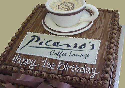 A cake celebrating a coffee houses 1st birthday